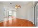 Open living area featuring hardwood floors, bright lighting, and architectural columns with views to entry foyer at 1125 English Garden Ln, Winter Garden, FL 34787