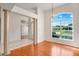 Bright living room boasting hardwood floors, large windows, and an open floor plan at 1125 English Garden Ln, Winter Garden, FL 34787