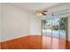 Inviting living room with hardwood floors and sliding glass doors providing views of the backyard at 1125 English Garden Ln, Winter Garden, FL 34787