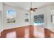 Spacious living room with hardwood floors, large windows, and direct access to the pool area at 1125 English Garden Ln, Winter Garden, FL 34787