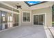 Covered patio boasts multiple sliding glass doors offering seamless indoor-outdoor living at 1125 English Garden Ln, Winter Garden, FL 34787