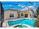 Inviting pool boasts a screened enclosure, spa, and spacious patio for ultimate outdoor enjoyment at 1125 English Garden Ln, Winter Garden, FL 34787