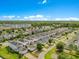 Bird's eye view of the neighborhood showcasing the uniformity of the houses and well-planned streets at 11865 Ginsberg Pl, Orlando, FL 32832