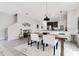 Dining room with modern table, chairs, and decor under pendant lights, perfect for Gathering meals and entertaining at 11865 Ginsberg Pl, Orlando, FL 32832