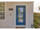 Welcoming blue front door with glass panels and modern hardware at 11865 Ginsberg Pl, Orlando, FL 32832