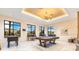 Bright game room with a pool table and foosball for entertaining at 11865 Ginsberg Pl, Orlando, FL 32832