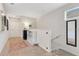 Bright hallway with carpet flooring and a modern mirror at 11865 Ginsberg Pl, Orlando, FL 32832