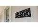 Close-up of the house number '11865' in a modern, easy-to-read font at 11865 Ginsberg Pl, Orlando, FL 32832