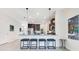 Modern kitchen with granite countertops, stainless steel appliances, and bar stool seating at the eat-in island at 11865 Ginsberg Pl, Orlando, FL 32832