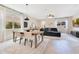 Open floorplan with dining area flowing into a living room; a stylish and functional design for modern living at 11865 Ginsberg Pl, Orlando, FL 32832