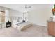 Elegant bedroom with a plush bed, stylish dresser, and a ceiling fan at 11865 Ginsberg Pl, Orlando, FL 32832