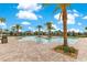 Large community pool featuring lush tropical landscaping at 11865 Ginsberg Pl, Orlando, FL 32832