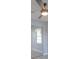 Bedroom featuring a ceiling fan, wood floors, and mirrored closet doors at 3955 Sw 139Th Street Rd, Ocala, FL 34473