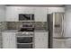 Kitchen features stainless steel appliances and granite countertops at 3955 Sw 139Th Street Rd, Ocala, FL 34473