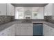 Open kitchen features a breakfast bar and view to living space at 3955 Sw 139Th Street Rd, Ocala, FL 34473