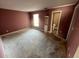 Bedroom with outdated mauve colored walls, and an en-suite bathroom at 13026 Baltimore Woods Ln, Orlando, FL 32824