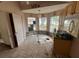 Bright kitchen area with tiled floors, wooden cabinets, and natural lighting at 13026 Baltimore Woods Ln, Orlando, FL 32824