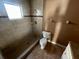 Shower featuring tiled walls, updated fixtures, and a glass door at 13026 Baltimore Woods Ln, Orlando, FL 32824