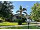 Charming single-story home with lush landscaping and a well-maintained lawn at 9632 Spring Lake Dr, Clermont, FL 34711