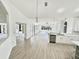 Open-concept living space with wood floors and an abundance of natural light at 9632 Spring Lake Dr, Clermont, FL 34711