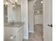 Bathroom featuring a granite countertop vanity and tile flooring and modern light fixture at 508 Bacio St, New Smyrna Beach, FL 32168