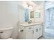 Updated bathroom with granite counters, tile floors, and modern lighting at 508 Bacio St, New Smyrna Beach, FL 32168