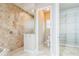 Elegant bathroom with tiled shower and glass doors at 508 Bacio St, New Smyrna Beach, FL 32168