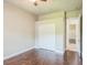 Neutral bedroom featuring a ceiling fan, ensuite, and closet for optimal organization at 508 Bacio St, New Smyrna Beach, FL 32168