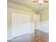 Bedroom with hardwood floors and double door closet at 508 Bacio St, New Smyrna Beach, FL 32168