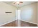 Neutral bedroom with wood floors, a ceiling fan, and trim for a clean and classic look at 508 Bacio St, New Smyrna Beach, FL 32168