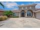 Well-maintained single-story home with a three-car garage, decorative stone accents, and a landscaped front yard at 508 Bacio St, New Smyrna Beach, FL 32168
