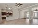 Open-plan living room boasts tile flooring, recessed lighting, kitchen views, and neutral paint at 508 Bacio St, New Smyrna Beach, FL 32168