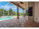 The screened patio includes ceiling fans, outdoor kitchen, access to the backyard and a swimming pool at 508 Bacio St, New Smyrna Beach, FL 32168