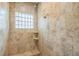 Modern shower with tiled walls and shower head at 508 Bacio St, New Smyrna Beach, FL 32168