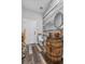 Unique powder bath features a vessel sink on a barrel, stylish lighting, and wood plank accent wall at 11657 Moore Rd, Lakeland, FL 33809