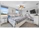 Bright bedroom with large windows, a ceiling fan, and a vanity area at 11657 Moore Rd, Lakeland, FL 33809