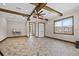 Large bonus room features tile floors, a ceiling fan, and lots of natural light at 11657 Moore Rd, Lakeland, FL 33809