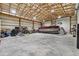 Huge well-lit garage space with room to store a pontoon boat and much equipment at 11657 Moore Rd, Lakeland, FL 33809