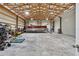 Spacious garage with high ceilings, equipped to store a pontoon boat and other equipment at 11657 Moore Rd, Lakeland, FL 33809