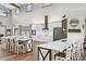 Bright, open kitchen features an island, breakfast bar, stainless steel appliances, and stylish cabinetry with abundant counter space at 11657 Moore Rd, Lakeland, FL 33809
