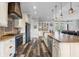 Stylish kitchen featuring custom cabinetry, stainless steel appliances, and an island with bar seating at 11657 Moore Rd, Lakeland, FL 33809