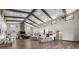 Expansive living space features wooden beams, an open kitchen, and ample seating at 11657 Moore Rd, Lakeland, FL 33809