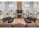 Comfortable living room with stone fireplace, high ceilings, and plenty of natural light at 11657 Moore Rd, Lakeland, FL 33809