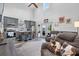 Open-concept living room and kitchen featuring high ceilings and stylish decor at 11657 Moore Rd, Lakeland, FL 33809