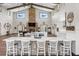 Open-concept space with kitchen island and fireplace, seamlessly blending living, cooking, and entertaining areas for modern lifestyle at 11657 Moore Rd, Lakeland, FL 33809