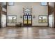 Open living space features tall ceilings, hardwood floors, and an abundance of natural light at 11657 Moore Rd, Lakeland, FL 33809