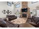 Spacious living area with stone fireplace, high ceilings and comfortable seating at 11657 Moore Rd, Lakeland, FL 33809