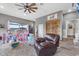 Cozy living room featuring comfortable seating, natural light, and rustic décor at 11657 Moore Rd, Lakeland, FL 33809