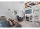 Spacious living room with a fireplace, television, and staircase to the second floor at 11657 Moore Rd, Lakeland, FL 33809