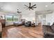 Large main bedroom with hardwood floors and natural light flooding through the windows at 11657 Moore Rd, Lakeland, FL 33809